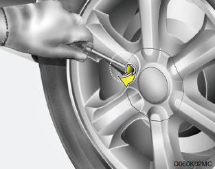 1. Wrap a piece of cloth around the tip of the flat-head screwdriver to avoid