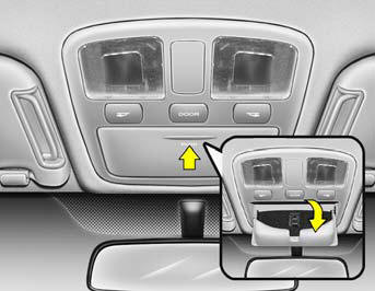 The sunglass holder is located on the front overhead console. Push the end of